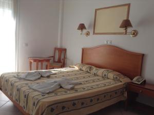 Postel nebo postele na pokoji v ubytování Hotel Meltemi