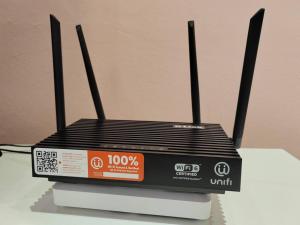 a black router sitting on top of a table at Petaling Jaya SS14 Bungalow for 20Pax, Plaza33 , 3 2 Square, Jaya One , SS2 in Petaling Jaya