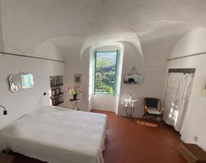 Ένα ή περισσότερα κρεβάτια σε δωμάτιο στο Casa Renata