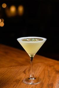 a martini glass sitting on top of a wooden table at Skeffington Arms Hotel in Galway