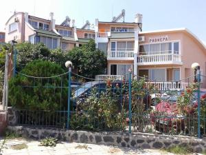 a fence in front of a building with a parking lot at Riviera Beach Hotel in Sozopol