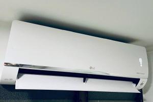 a white computer monitor sitting on top of a desk at Laureles best location with Jacuzzi and AC in Medellín