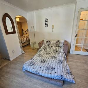 a bedroom with a bed in a room at Godricks Hollow House in Watford