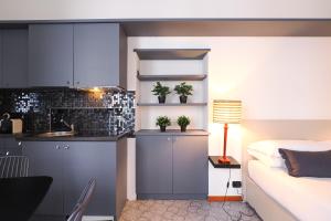 Η κουζίνα ή μικρή κουζίνα στο Duomo Terrace Suite +9 φωτογραφίες