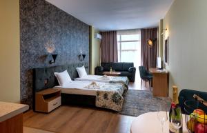 Postel nebo postele na pokoji v ubytování Hotel Avenue