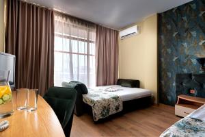 Llit o llits en una habitació de Hotel Avenue