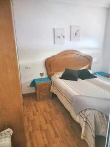 A bed or beds in a room at One bedroom apartement with city view shared pool and wifi at Belmonteb