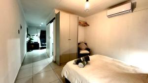 En eller flere senge i et værelse på Micro Urban Oasis 2