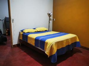 Tempat tidur dalam kamar di Casa Donaji
