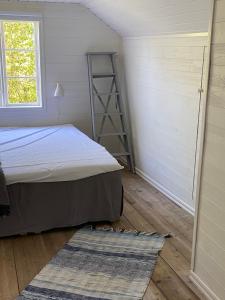 Postel nebo postele na pokoji v ubytování Ingmarsö B&B