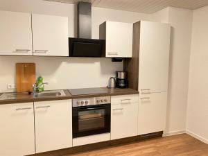 Η κουζίνα ή μικρή κουζίνα στο K41 - Haus mit Garten - Max 8 Personen - ab 5 Nächte - Perfekt für Geschäftsreisende,Teams,Monteure I Messe I A81 I Stuttgart
