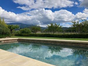 a swimming pool with a view of the mountains at Mas de grange neuve in Mollans-sur-Ouvèze +32 photos