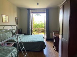 Posteľ alebo postele v izbe v ubytovaní Hotel Belvedere