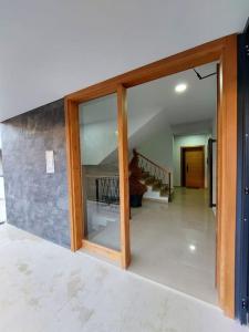 a room with a glass door and a staircase at Condo "Comfort" in Vlorë