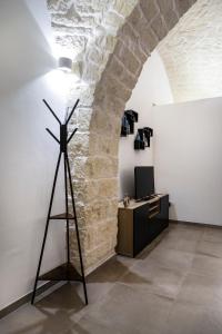 a wind turbine in a room with a wall at Da zia Giovanna Apartment in Manfredonia