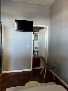 TV a/nebo společenská místnost v ubytování Residencial Funchal