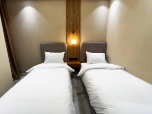 Postel nebo postele na pokoji v ubytování AMBAR RESIDENCE
