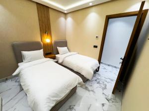 Postel nebo postele na pokoji v ubytování AMBAR RESIDENCE