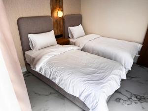 Postel nebo postele na pokoji v ubytování AMBAR RESIDENCE