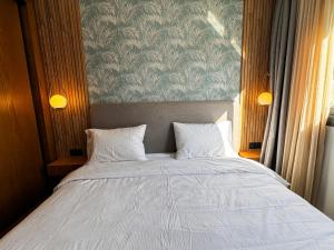 Postel nebo postele na pokoji v ubytování AMBAR RESIDENCE