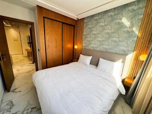 Postel nebo postele na pokoji v ubytování AMBAR RESIDENCE