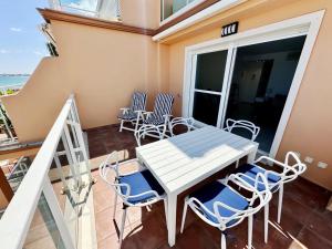 a balcony with a table and chairs on it at Mirador al Mar 12 in Denia