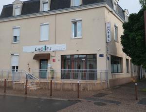 a building with a sign on the front of it at lhotel in Thouars