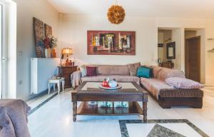 a living room with a couch and a table at Saint George Apartment in Preveza