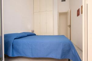 Posteľ alebo postele v izbe v ubytovaní Appartamento Eva