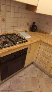 a kitchen with a stove and a counter top at CASA CENTRO STORICO VOLTERRA in Volterra