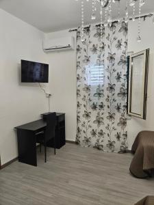 TV a/nebo společenská místnost v ubytování B&B IL Pistacchio