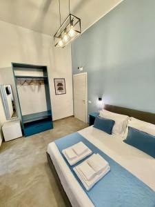 a large bedroom with two beds and a mirror at Bausan Avenue in Naples
