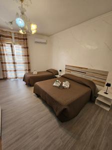Postel nebo postele na pokoji v ubytování B&B IL Pistacchio