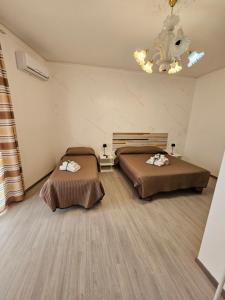 Postel nebo postele na pokoji v ubytování B&B IL Pistacchio