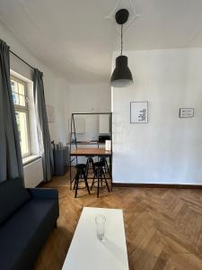 a living room with a couch and a table at Villa Rathenow in Rathenow