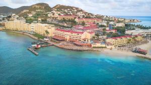 an aerial view of a beach with buildings and the ocean at Simpson Bay Resort Marina & Spa in Simpson Bay