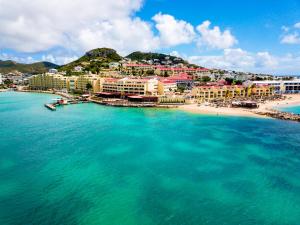 an aerial view of a beach with buildings and the ocean at Simpson Bay Resort Marina & Spa in Simpson Bay