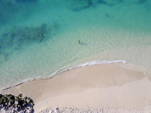 an aerial view of a beach with a boat in the water at Simpson Bay Resort Marina & Spa in Simpson Bay