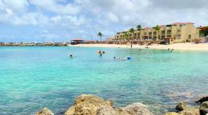 a group of people in the water at a beach at Simpson Bay Resort Marina & Spa in Simpson Bay