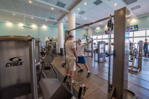 two men standing in a gym with weights at Simpson Bay Resort Marina & Spa in Simpson Bay
