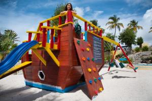 a woman is standing on top of a playground at Simpson Bay Resort Marina & Spa in Simpson Bay