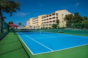 a tennis court in front of a hotel at Simpson Bay Resort Marina & Spa in Simpson Bay
