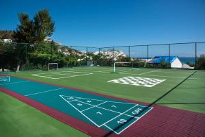 a tennis court with a net on top of it at Simpson Bay Resort Marina & Spa in Simpson Bay