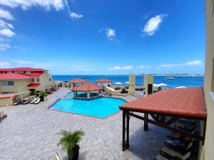 a swimming pool with a view of the ocean at Simpson Bay Resort Marina & Spa in Simpson Bay
