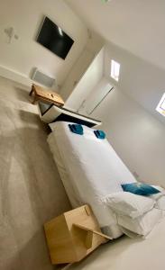 an attic room with a bed and a box at JP Short Stays in Upton upon Severn