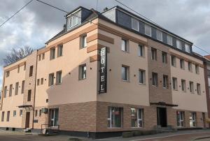 a large brick building with a sign on it at Hotel Art Balkanhof in Gelsenkirchen