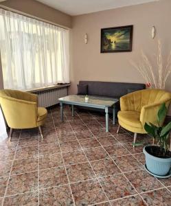 A seating area at Family Hotel Selena