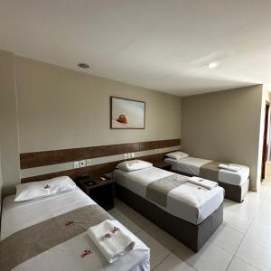 เตียงในห้องที่ Onix Hotel Aeroporto