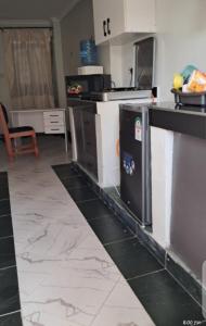 a kitchen with a counter top and a counter top at Palm homes in Mutomo