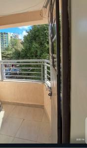 a view of a balcony from a train window at Palm homes in Mutomo